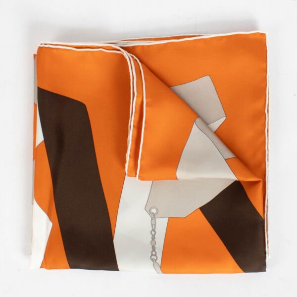 Are you looking for an authentic designer accessory? We buy and sell your preloved and brand new Hermès Orange Silk En Duo Carré 90 Scarf.